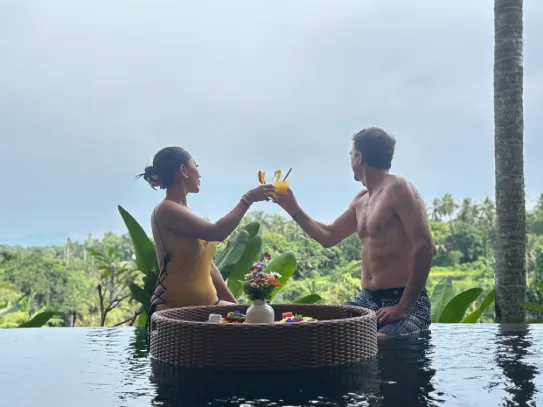 Romantic floating breakfast for two in a private pool.