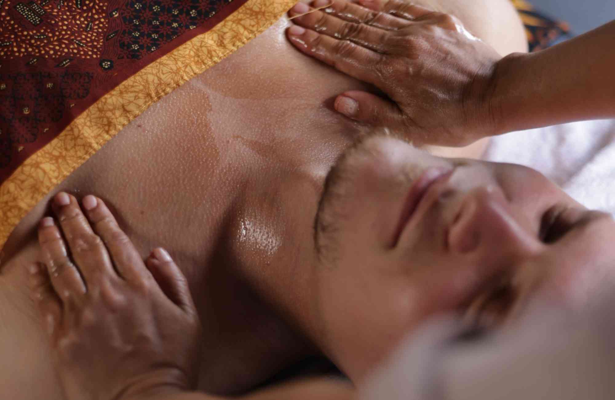 A peaceful spa setting where a soothing massage is being performed to promote relaxation and rejuvenation