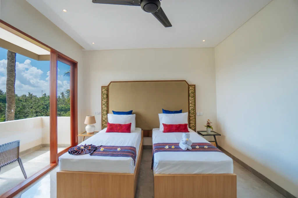 twin bed room with nature view at the bodhi leaf bali