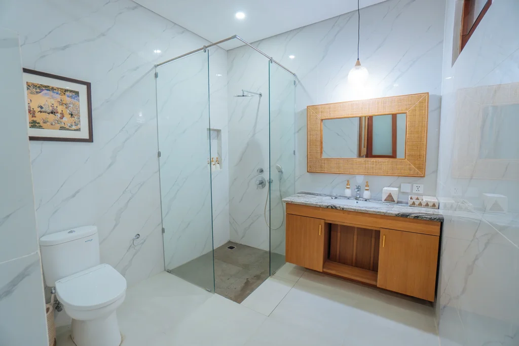 clean bathroom with shower and toilet at the bodhi leaf bali