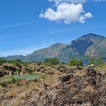 Adventurers embarking on the Batur trekking journey, capturing breathtaking views of the volcano and surrounding landscapes