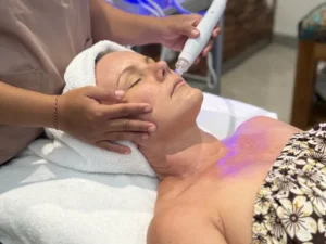 Woman receiving a relaxing facial spa treatment.