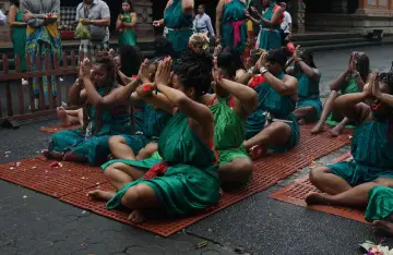 Balinese purification ceremony with traditional offerings and rituals