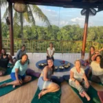 Participants experiencing a sound healing class with various instruments for relaxation
