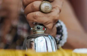 A traditional bell ringing during a worship ceremony, emitting a peaceful, resonant tone