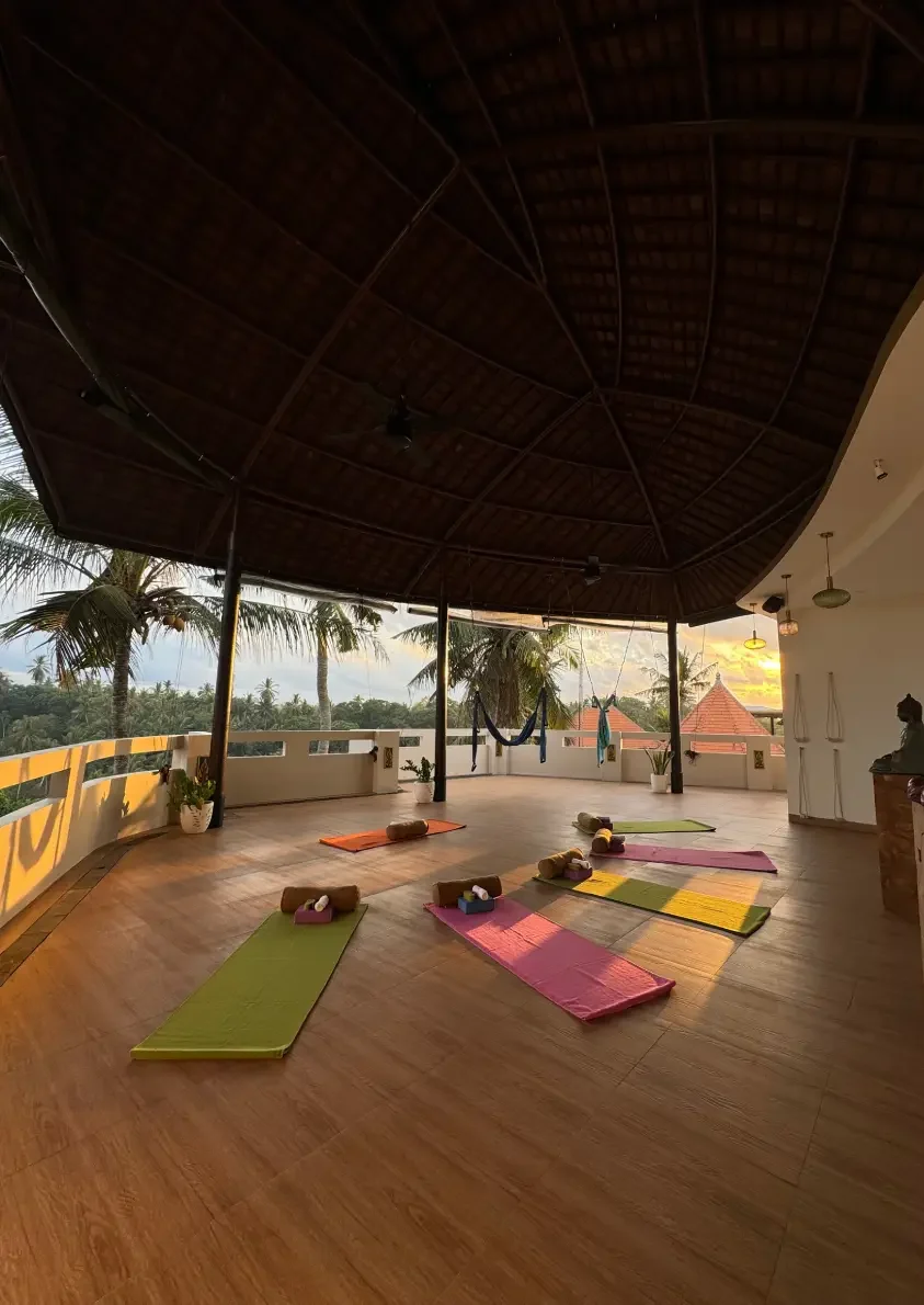 Woman practicing yoga in a serene outdoor setting