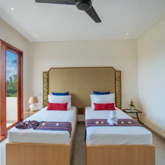 twin bed room with nature view at the bodhi leaf bali