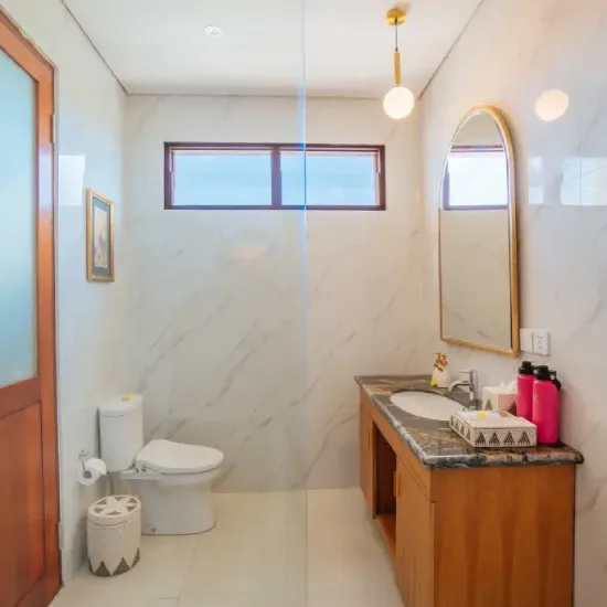 clean toilet with mirror at the bodhi leaf bali