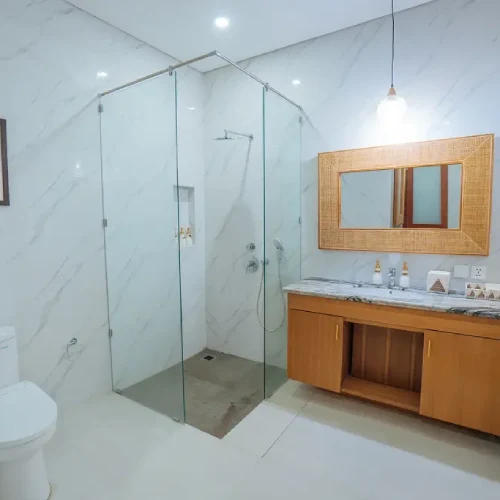 clean bathroom with shower and toilet at the bodhi leaf bali