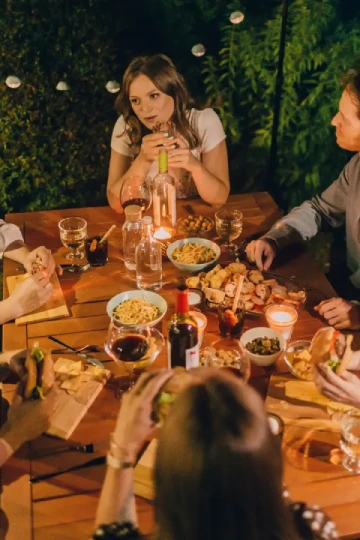 a group of people have a dinner in one table