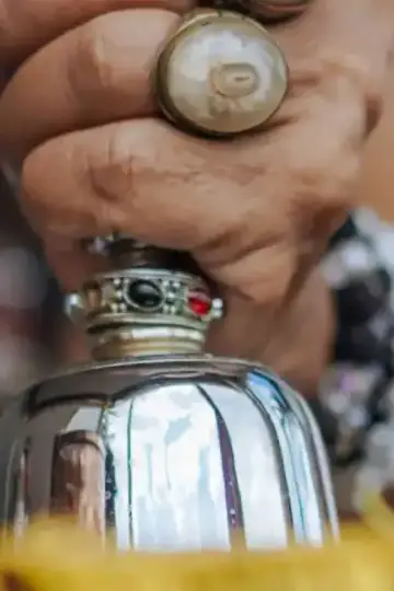 A traditional bell ringing during a worship ceremony, emitting a peaceful, resonant tone