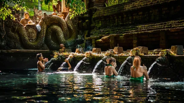 Traditional Balinese purification ritual performed in sacred water for spiritual cleansing