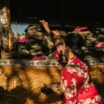 Traditional Balinese ceremony with offerings and cultural rituals.