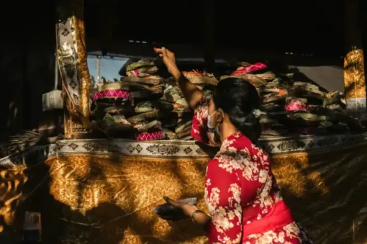 Traditional Balinese ceremony with offerings and cultural rituals.