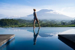Peaceful infinity pool view over green mountains and rice terraces