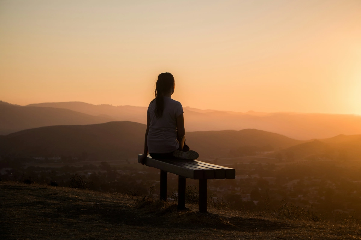 Woman enjoying a peaceful sunset view